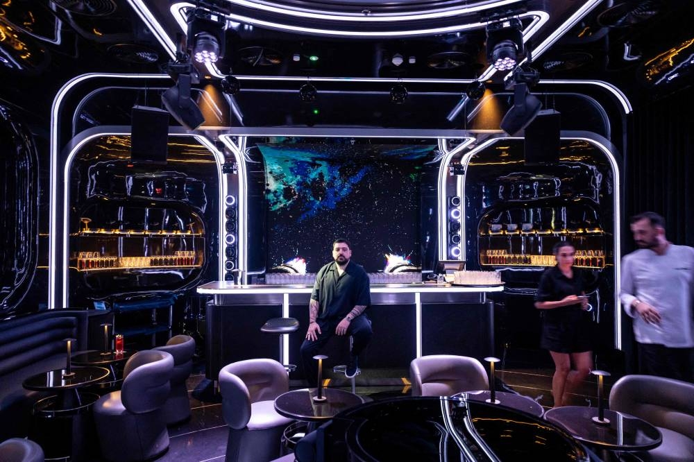 In this photograph taken on November 12, 2025, Oytun Cakir, co-founder of AI-powered restaurant Woohoo, poses for a portrait in Dubai. 