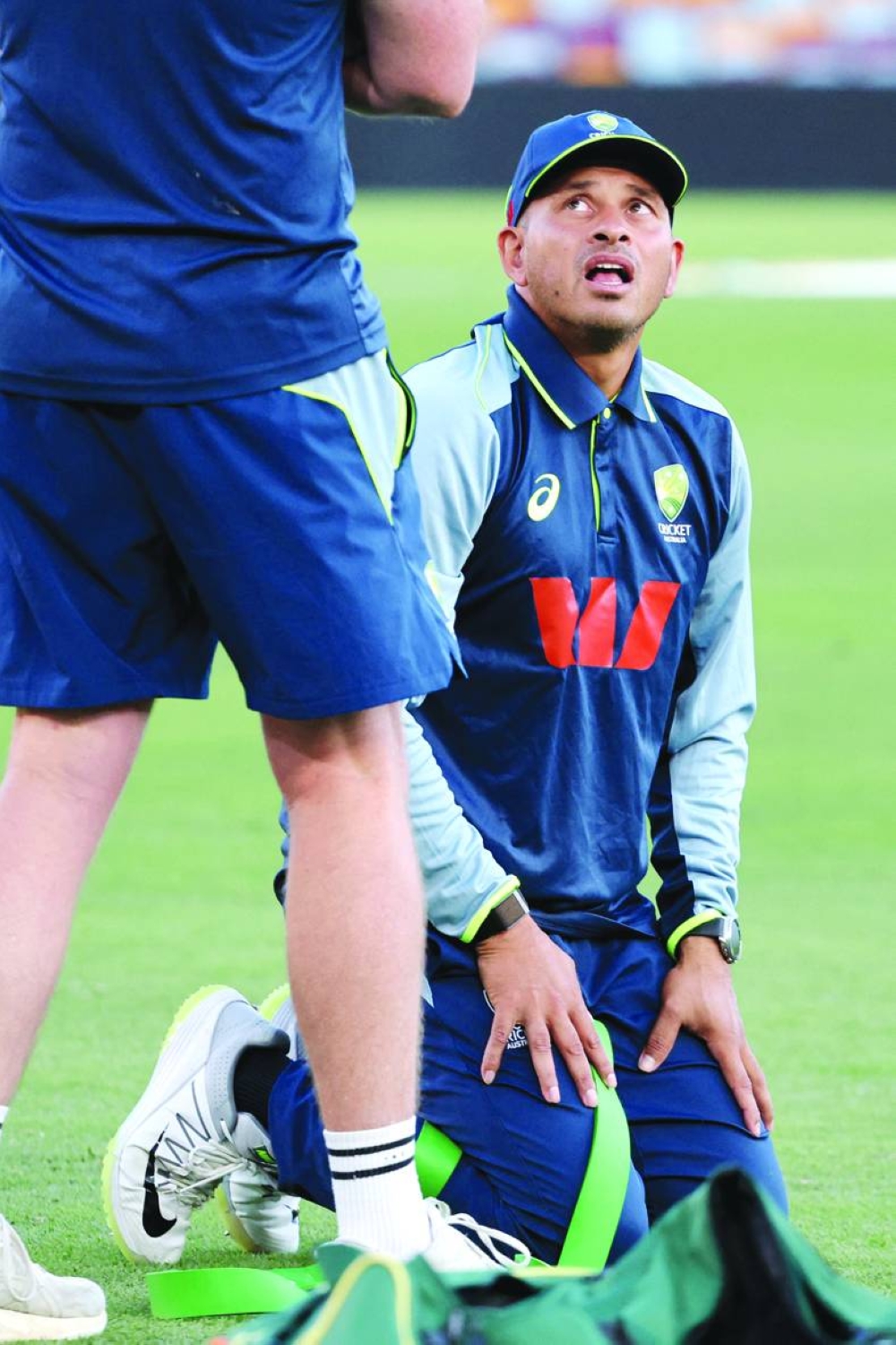 Australia’s Usman Khawaja reacts as he stretches during a training session in Brisbane Tuesday.