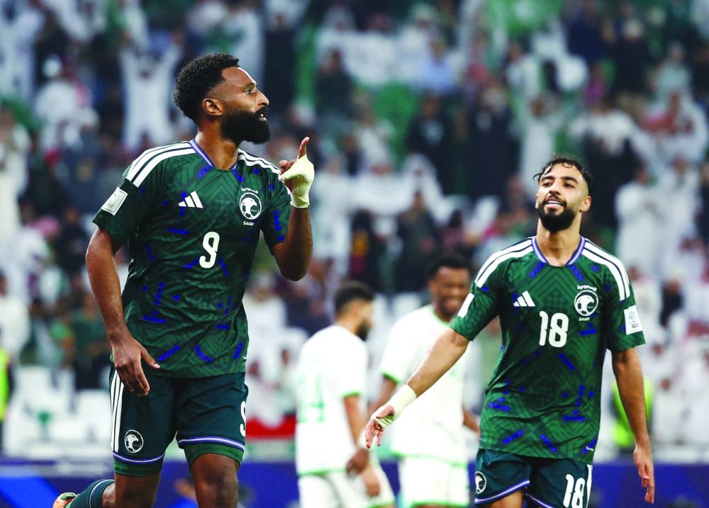 Saudi Arabia’s Firas al-Buraikan celebrates scoring a goal during their FIFA Arab Cup Qatar 2025 Group B match against Oman at Education City Stadium in Doha Tuesday. (Reuters)