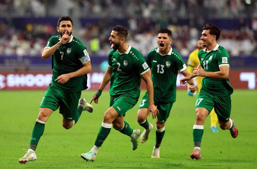 Soccer Football - FIFA Arab Cup - Qatar 2025 - Group A - Syria v Qatar - Khalifa International Stadium, Doha, Qatar - December 4, 2025
Syria's Omar Maher Khribin celebrates scoring their first goal with teammates REUTERS
