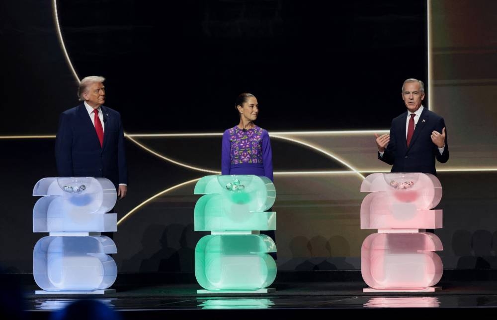 US President Donald Trump, Mexico's President Claudia Sheinbaum and Canada's Prime Minister Mark Carney during the FIFA World Cup 2026 Draw at John F. Kennedy Center for the Performing Arts, Washington, DC, US on December 5, 2025. (AFP)