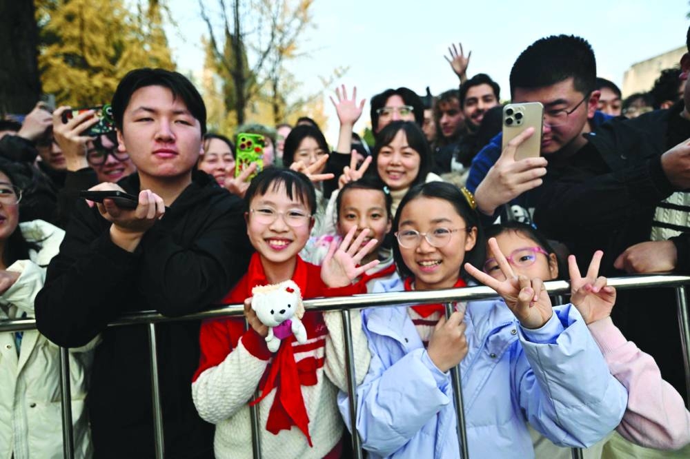 
People gather to see French President Emmanuel Macron at the University of Sichuan after a meeting with students in Chengdu. 