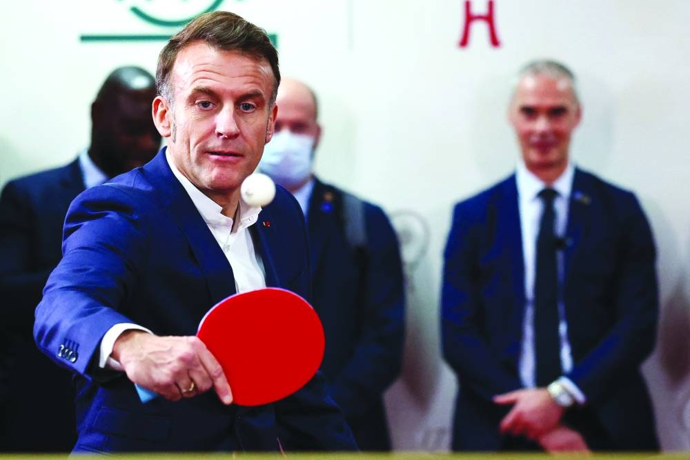 
Macron plays table tennis during a meeting with Chinese and French table tennis players and students at Sichuan University. 