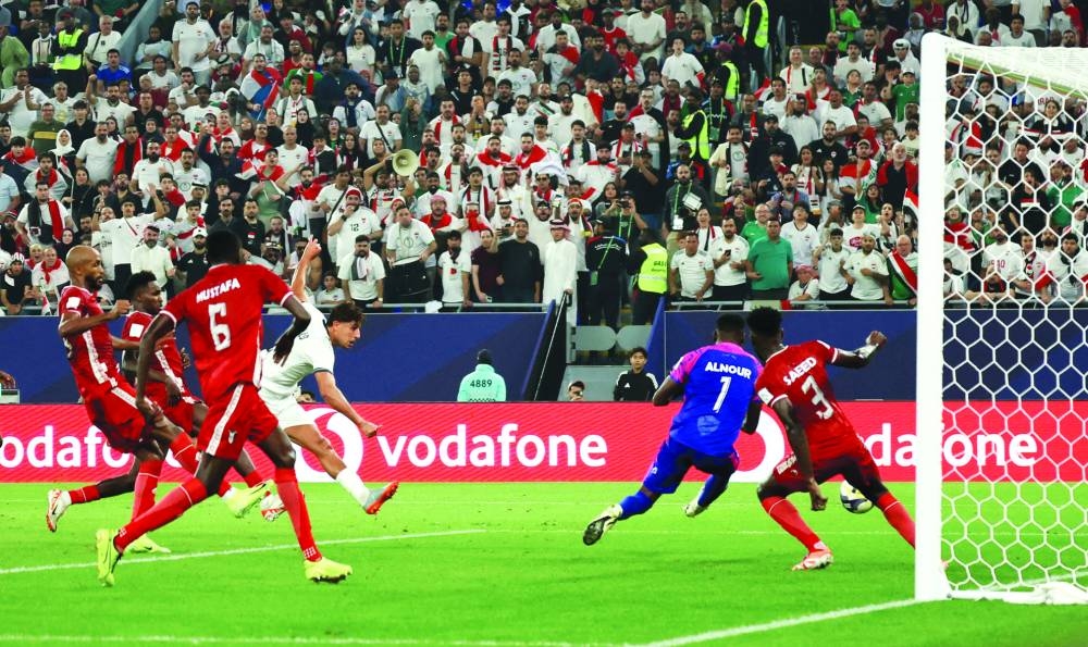 Iraq's Mohanad Ali scores against Sudan at Stadium 974.
