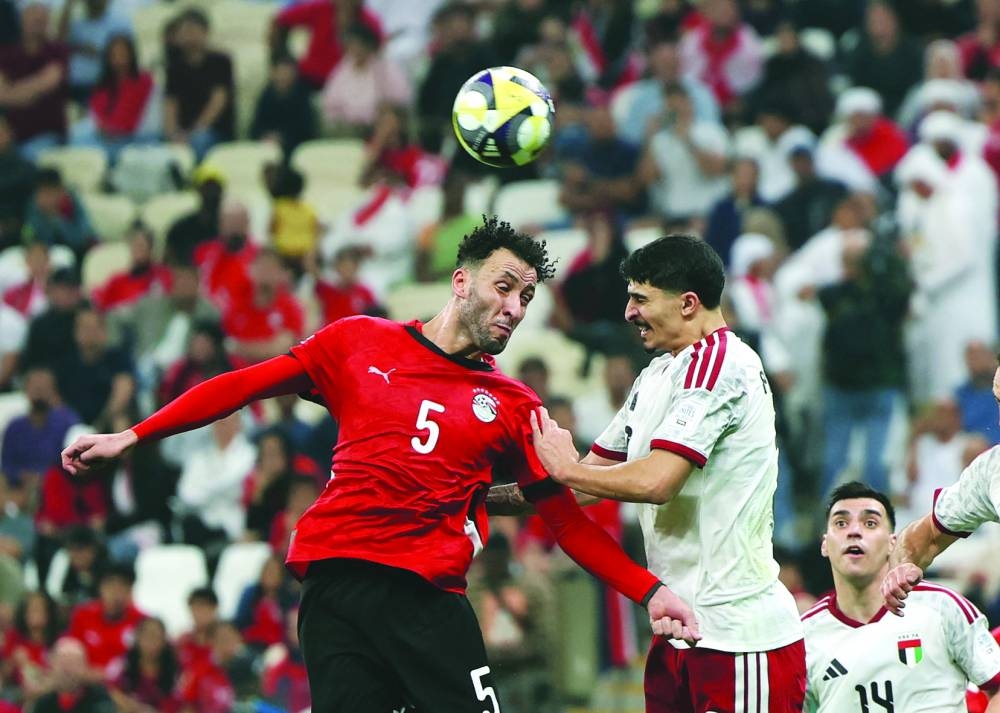 Egypt's Ragab Nabil in action with United Arab Emirates' Lucas Pimenta at the Lusail Stadium.