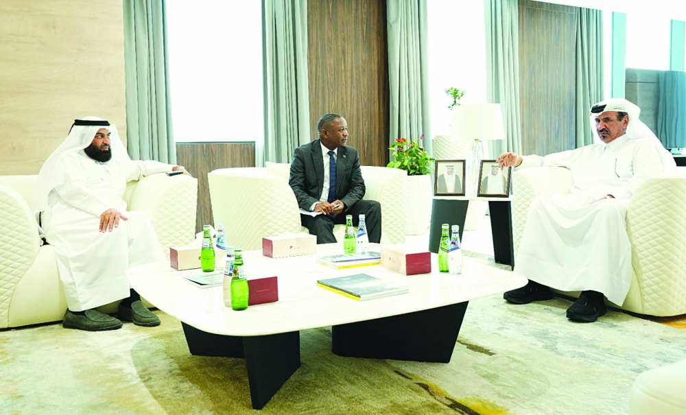 Al-Kuwari and Zambian embassy charge d'affaires Stanley Katshabi in a huddle while Qatar Chamber board member Dr Mohammed bin Jawhar al-Mohammed looks on.