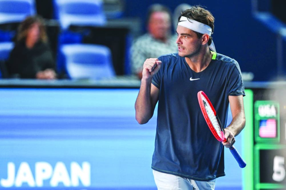 Taylor Fritz of the US pumps his fist after winning the first set against Cameron Norrie of Britain during their Japan Open match in Tokyo yesterday. (AFP)