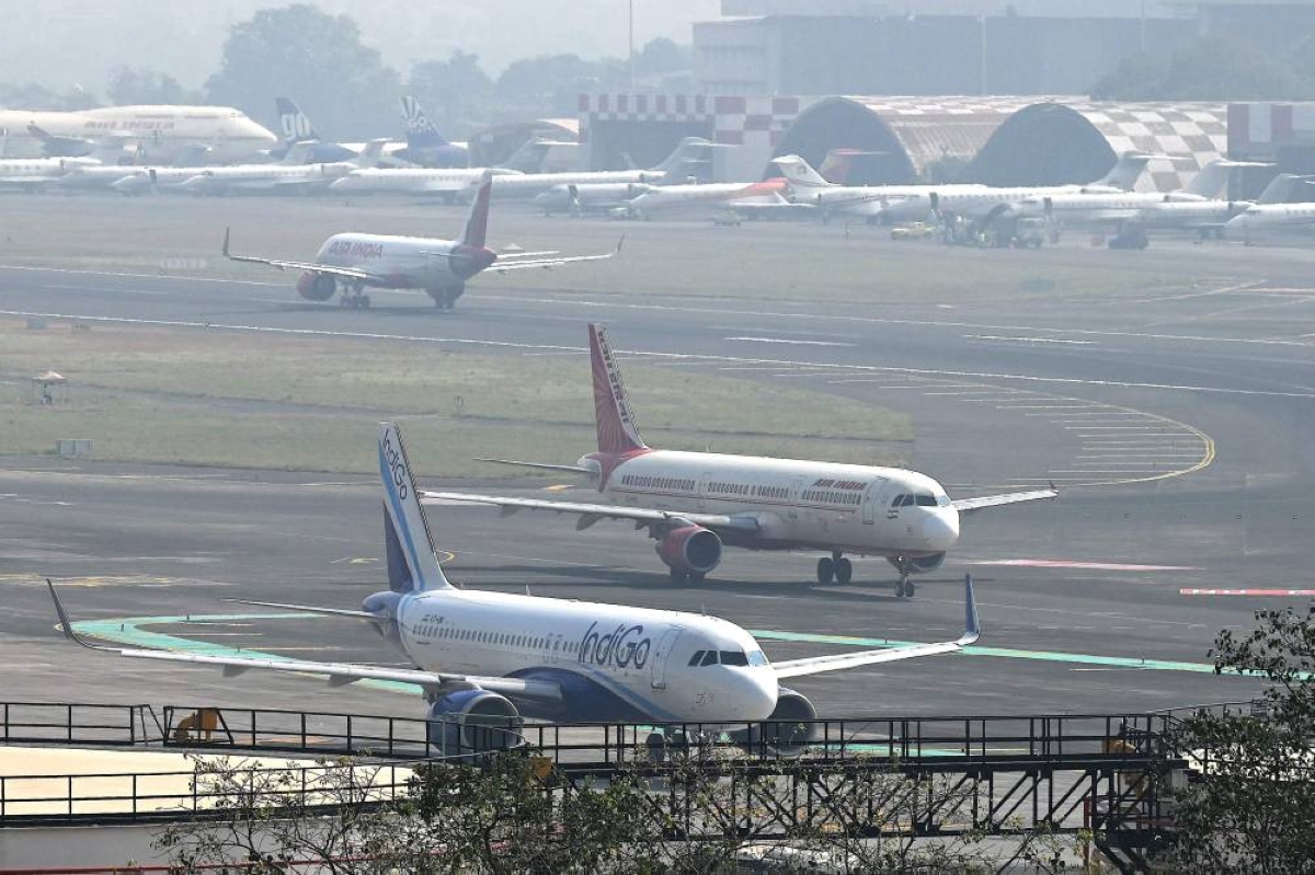 Aircrafts of Indian airlines IndiGo and Air India prepare to takeoff at the Chhatrapati Shivaji Maharaj International Airport in Mumbai on December 8, 2025. (AFP)