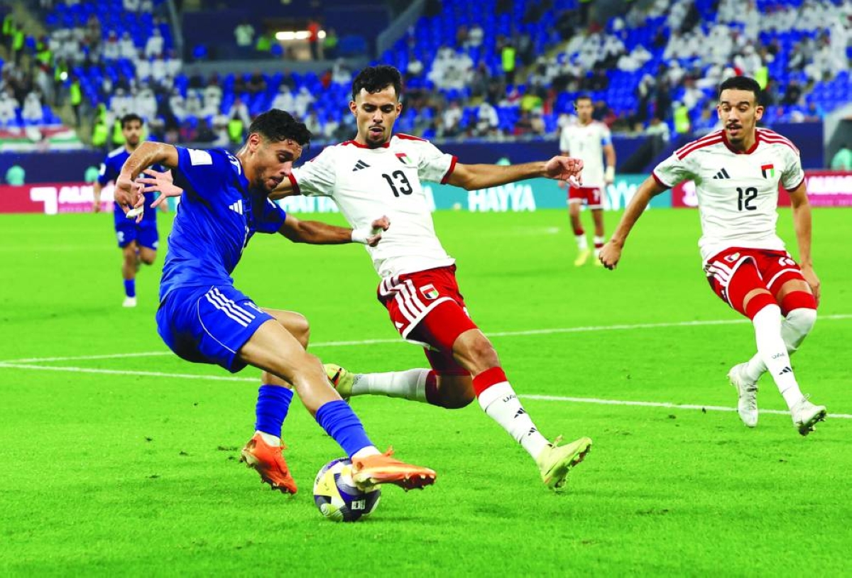 Soccer Football - FIFA Arab Cup - Qatar 2025 - Group C - United Arab Emirates v Kuwait - Stadium 974, Doha, Qatar - December 9, 2025
Kuwait's Eid Al Rashidi in action with United Arab Emirates' Mohammad Jumah REUTERS
