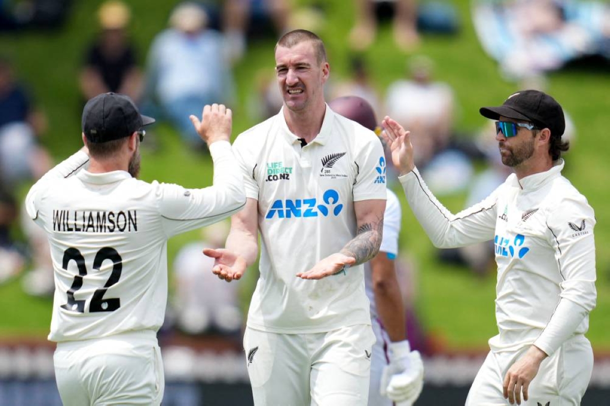 New Zealand's Blair Tickner (R) celebrates the wicket of West Indies' Brandon King with teammates during day one of the 2nd international Test cricket match between New Zealand and West Indies at the Basin reserve in Wellington on December 10, 2025. (Photo by Marty MELVILLE / AFP)