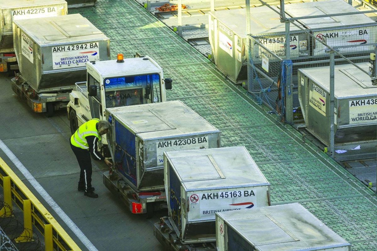 A cargo handler prepares air freight containers for a British Airways  flight at Heathrow Airport in London. Air cargo has consistently proven itself as a crucial stabiliser for the global economy; its inherent agility successfully blunting the impact of the 2025 tariff cycle and mitigating the severe disruptions caused by the Covid-19 pandemic.