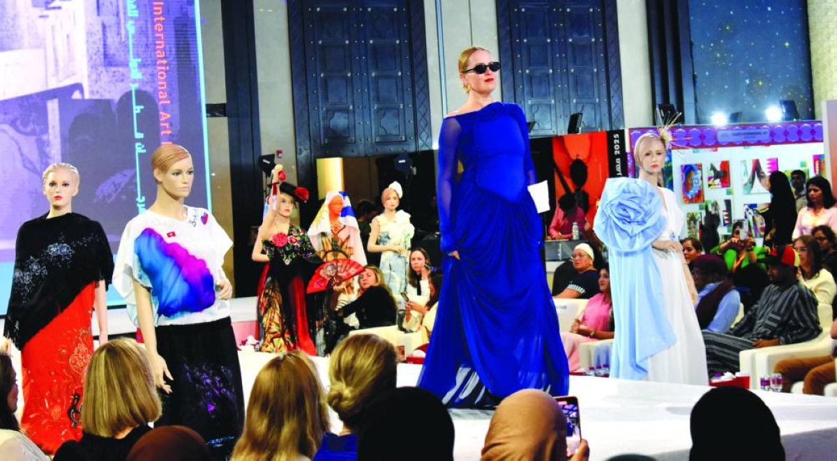 Artists from various countries present their designs during the fashion show at the QIAF Thursday.