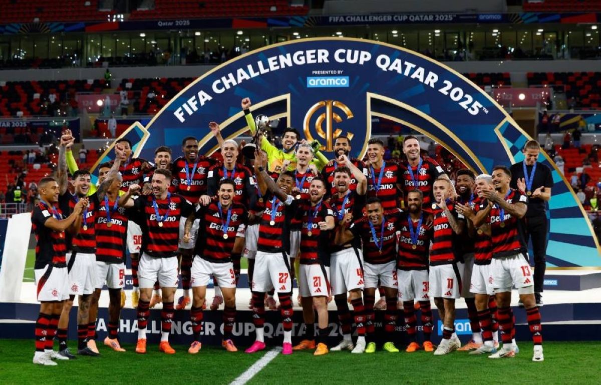 Flamengo's Bruno Henrique lifts the trophy as he celebrates with teammates after winning the FIFA Challenger Cup at Ahmad Bin Ali Stadium in Al Rayyan. (Reuters)