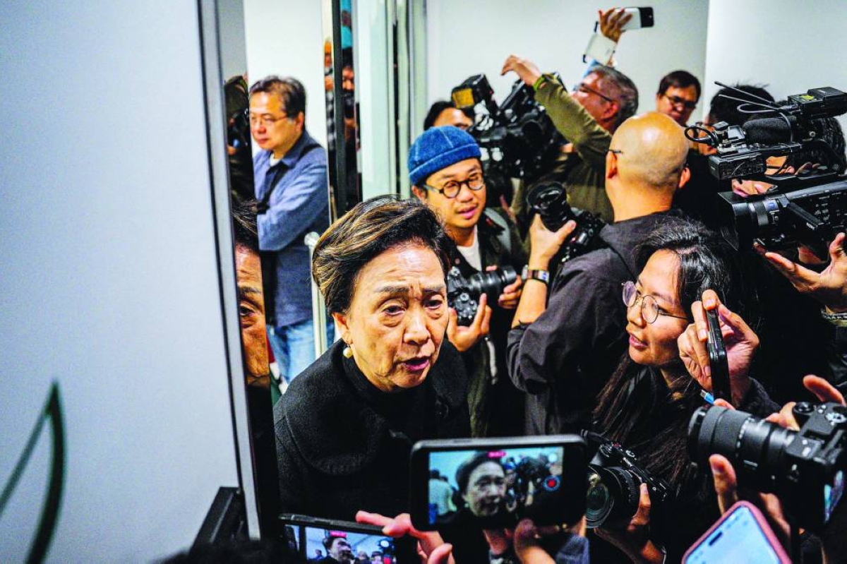 Former Democratic Party chairperson and legislator Emily Lau Wai-hing leaves the Democratic Party headquarters in Hong Kong. – AFP