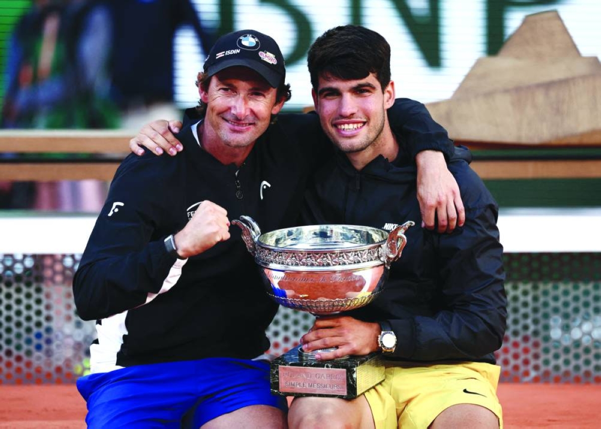 FILE PHOTO: Tennis - French Open - Roland Garros, Paris, France - June 9, 2024
Spain's Carlos Alcaraz celebrates with coach Juan Carlos Ferrero after winning the men's singles final against Germany's Alexander Zverev REUTERS/Yves Herman/File Photo