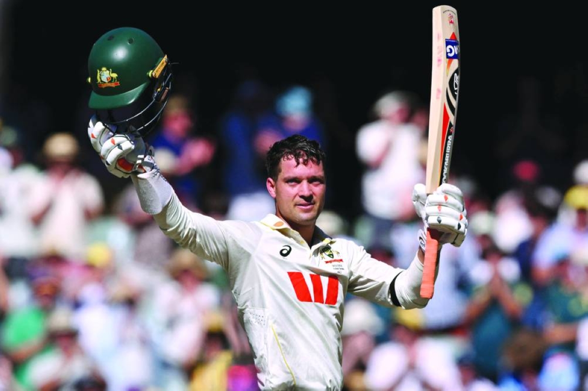 Australian batsman Alex Carey celebrates scoring a century on the first day of the third Ashes Test at the Adelaide Oval in Adelaide yesterday. (AFP) 