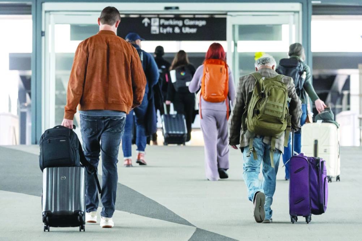 Travellers at San Francisco International Airport in California. The US is seeking to significantly expand its vetting of social media accounts for people who want to enter the country.