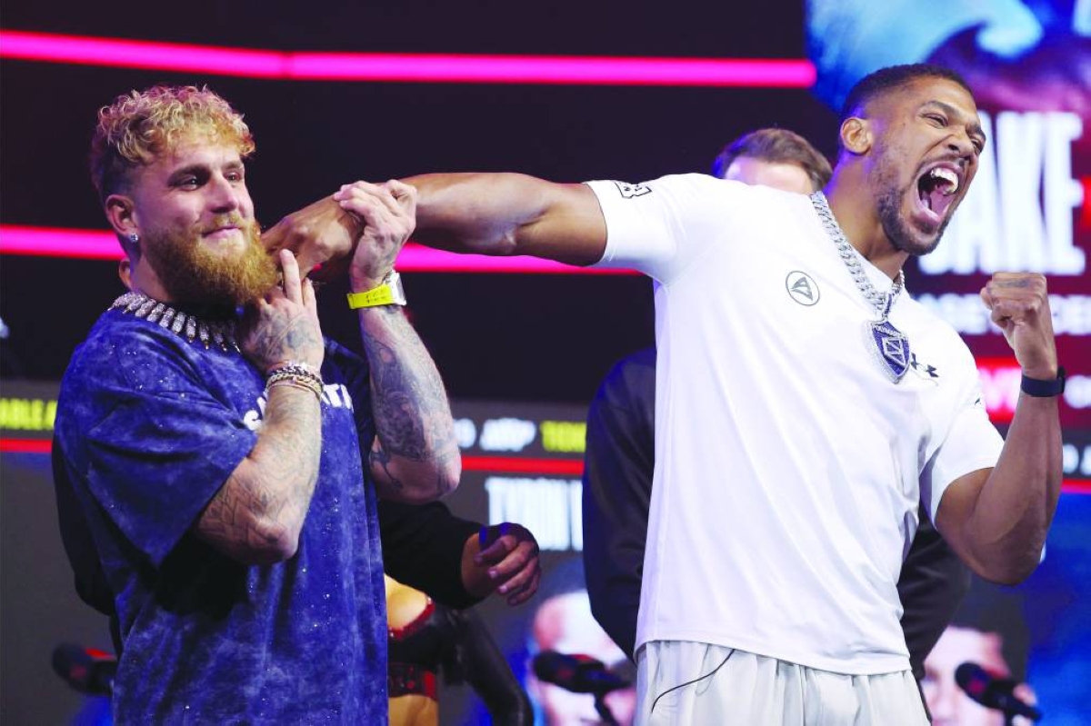Jake Paul and Anthony Joshua face off during the press conference at The Fillmore Miami Beach. (AFP)