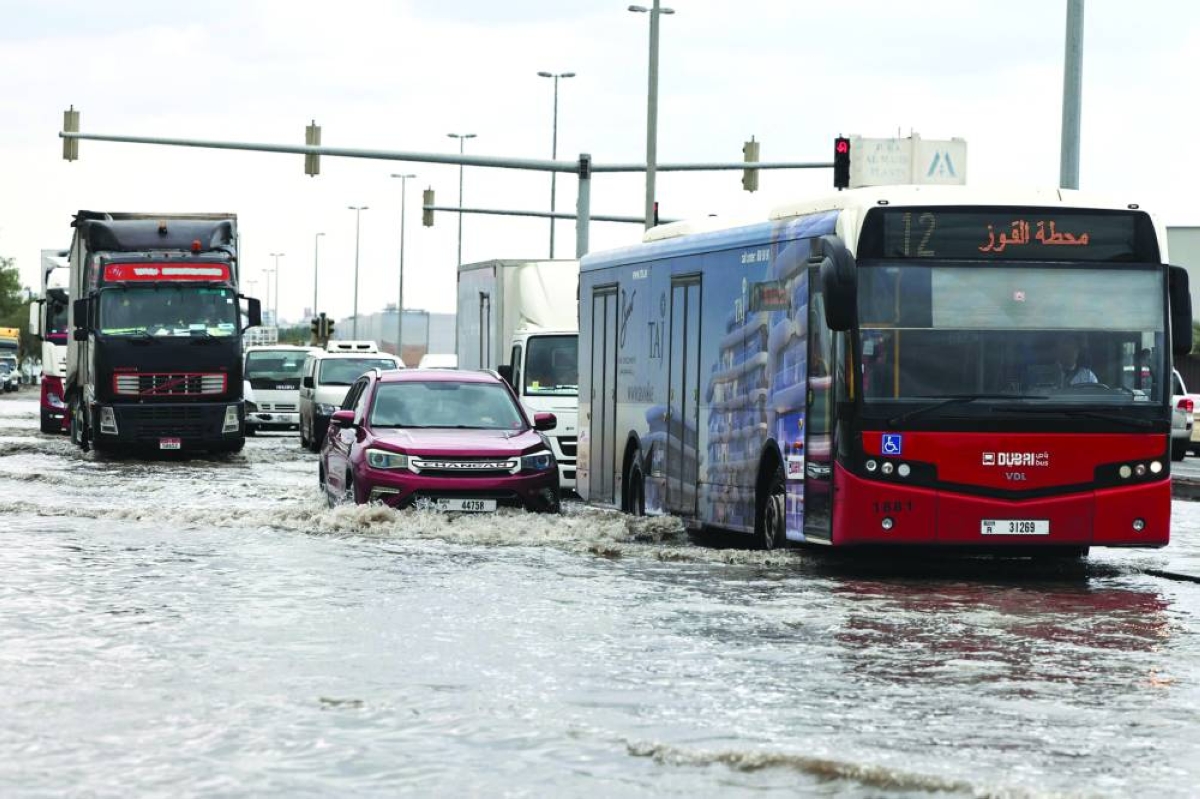 
Vehicles drive through floodwaters, in Dubai, yesterday. 