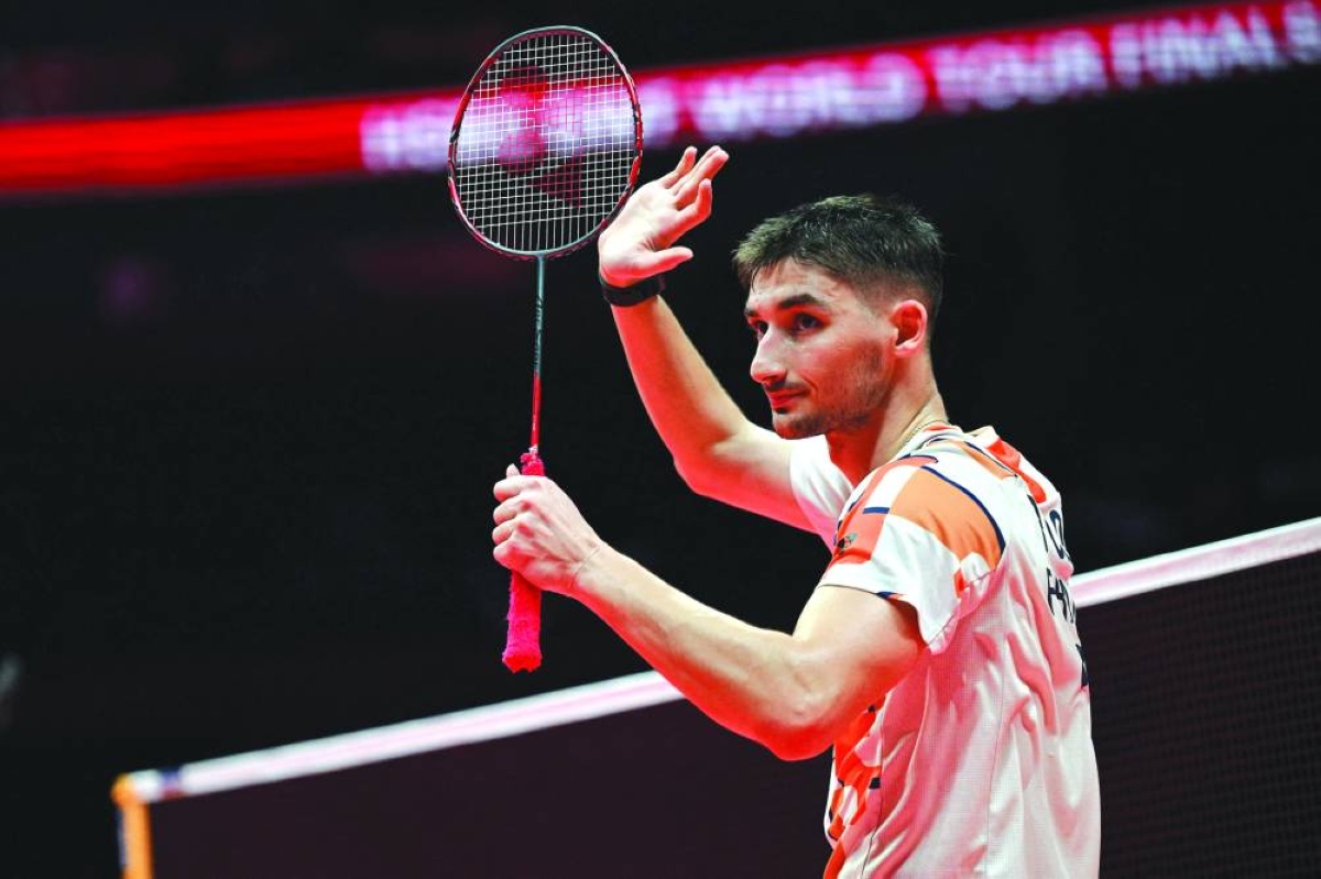 France’s Christo Popov reacts after defeating Japan’s Kodai Naraoka during their semi-final at the BWF Badminton World Tour Finals at the Hangzhou Olympic Sports Centre Gymnasium in Hangzhou, China, Saturday.(AFP)