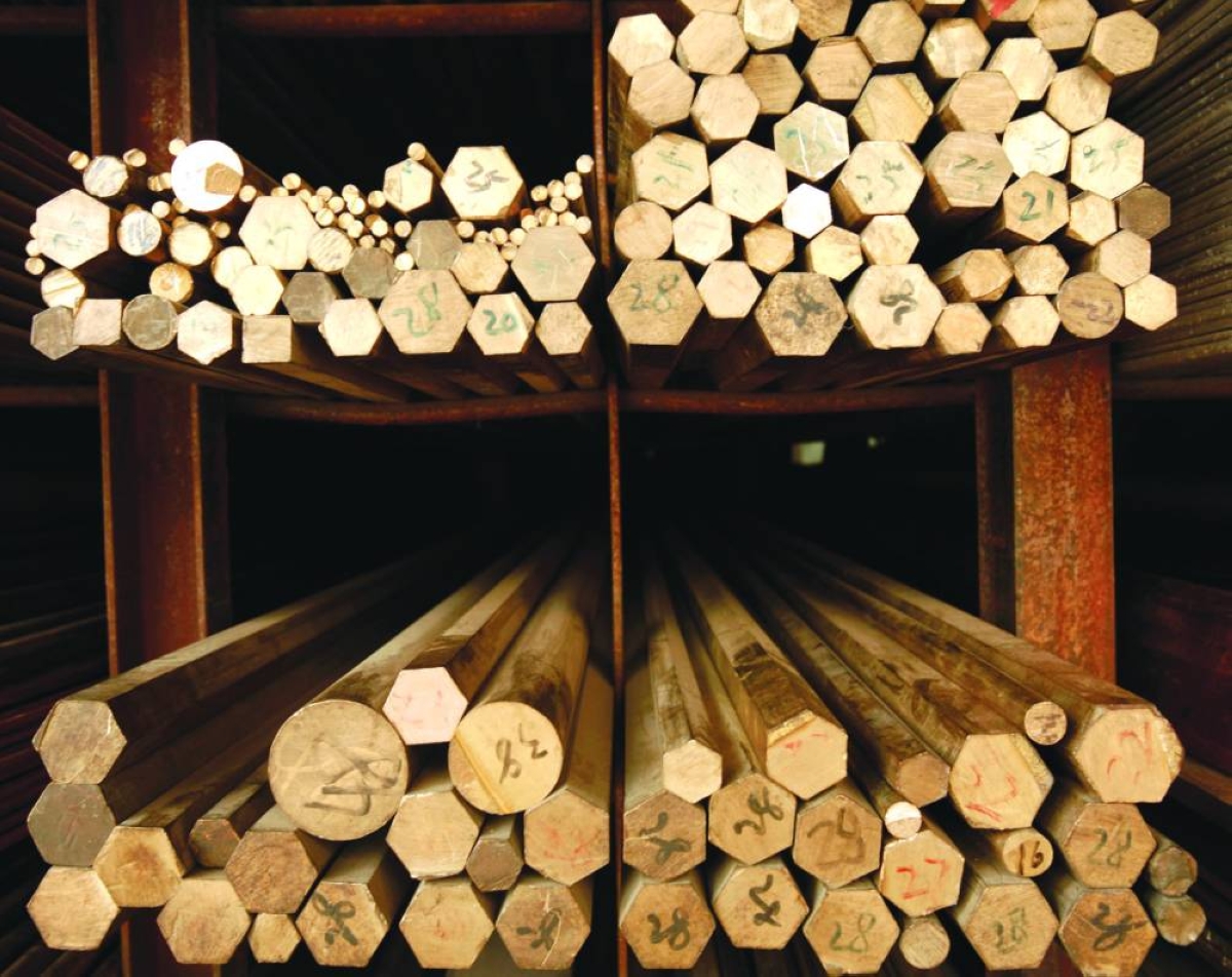 Copper rods are organised on a rack at a hardware store in Shanghai. In its weekly commentary, Qatar National Bank noted that despite cyclical volatility and macroeconomic pressures, the metal remains attractively valued in real terms.