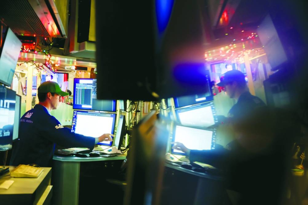 A trader works on the floor of the New York Stock Exchange. The US stock market is poised to be kept on edge next year as investors are caught between fear of missing out on the artificial-intelligence rally and concern that it’s a bubble just waiting to burst. 