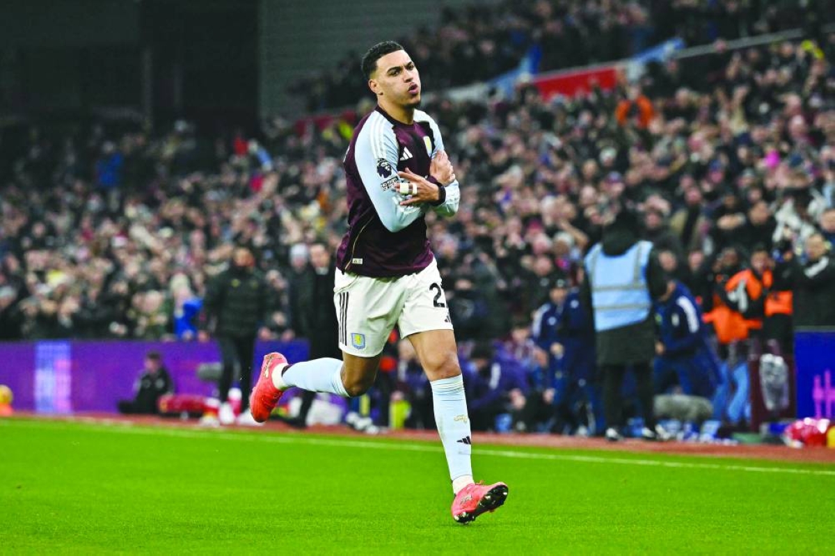 Aston Villa's English midfielder #27 Morgan Rogers celebrates scoring his team's first goal to take the lead 1-0 during the English Premier League football match between Aston Villa and Manchester United at Villa Park in Birmingham, central England on December 21, 2025. AFP