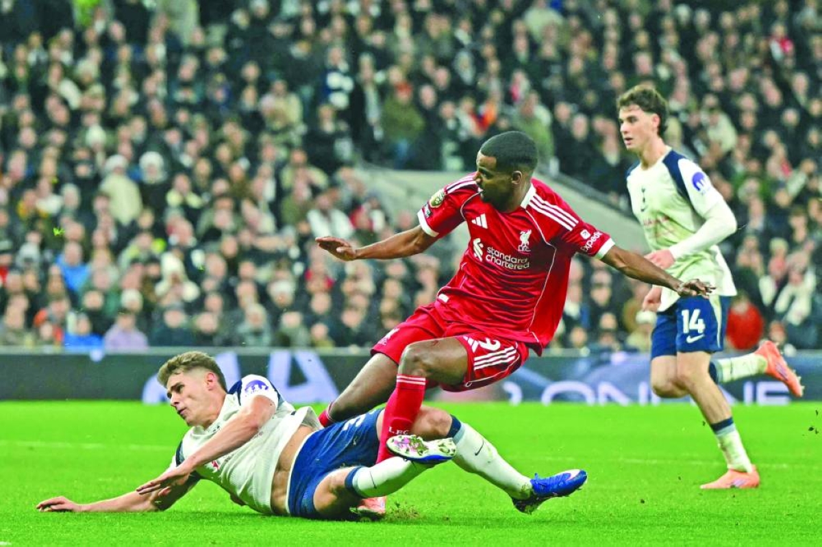 Liverpool's Swedish striker #09 Alexander Isak (C) gets injured in a challenge with Tottenham Hotspur's Dutch defender #37 Micky van de Ven as he scores the opening goal during the English Premier League football match between Tottenham Hotspur and Liverpool at the Tottenham Hotspur Stadium in London, on December 20, 2025. (AFP) 