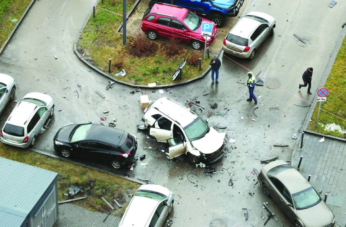 The damaged Kia Sorento lies at the scene where Lieutenant-General Fanil Sarvarov, head of the Russian General Staff's army operational training directorate, was killed in a car bomb in Moscow. Reuters