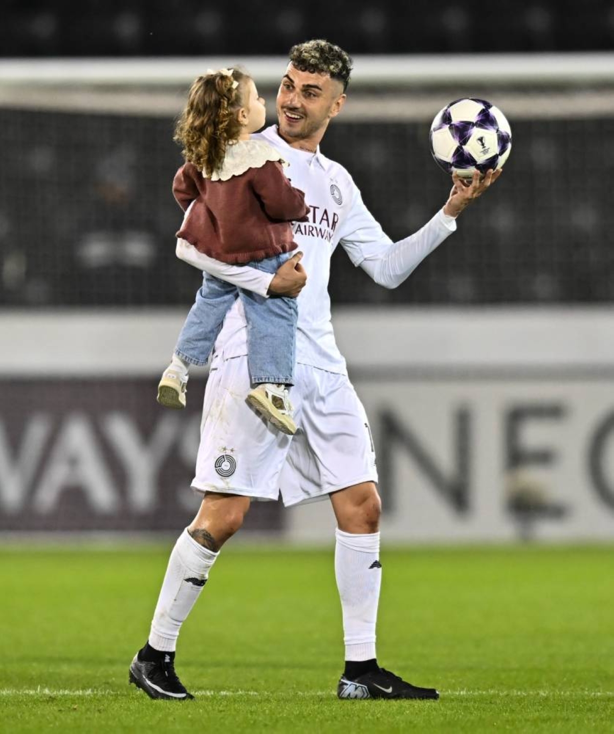 Rafa Mujica celebrates with his daughter after his hat-trick helped Al Sadd complete a dramatic win over Shabab Al Ahli in their AFC Champions League Elite tie at the Jassim Bin Hamad Stadium in Doha. 