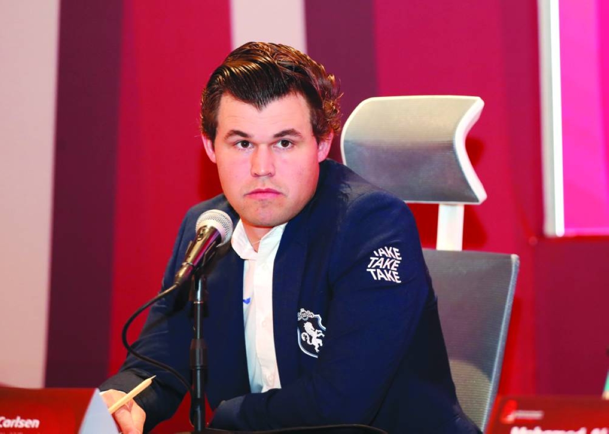 Magnus Carlsen (left) of Norway and Gukesh Dommaraju of India address a pre-event press conference Thursday ahead of the €1mn FIDE World Rapid & Blitz Championships in Doha.