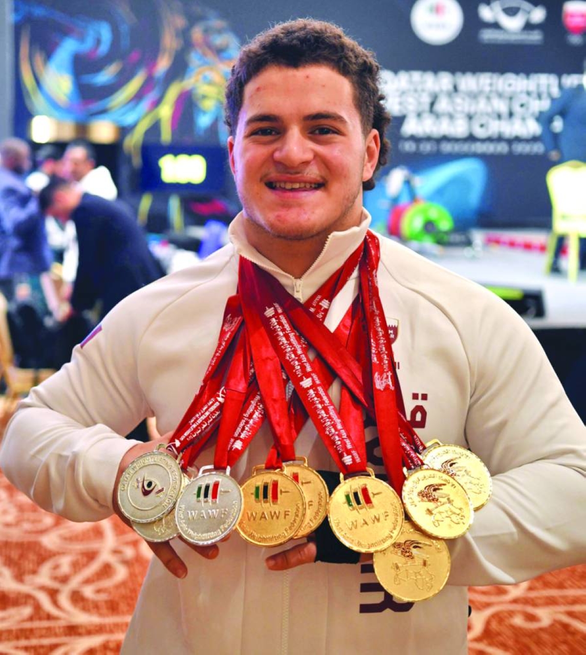 
Qatar’s Fares Ahmed Jaber poses with the 15 medals - 12 gold and 3 silver - he won on the final day of the 10th Qatar International Cup, an event that also included the Arab and the West Asian Championships. 