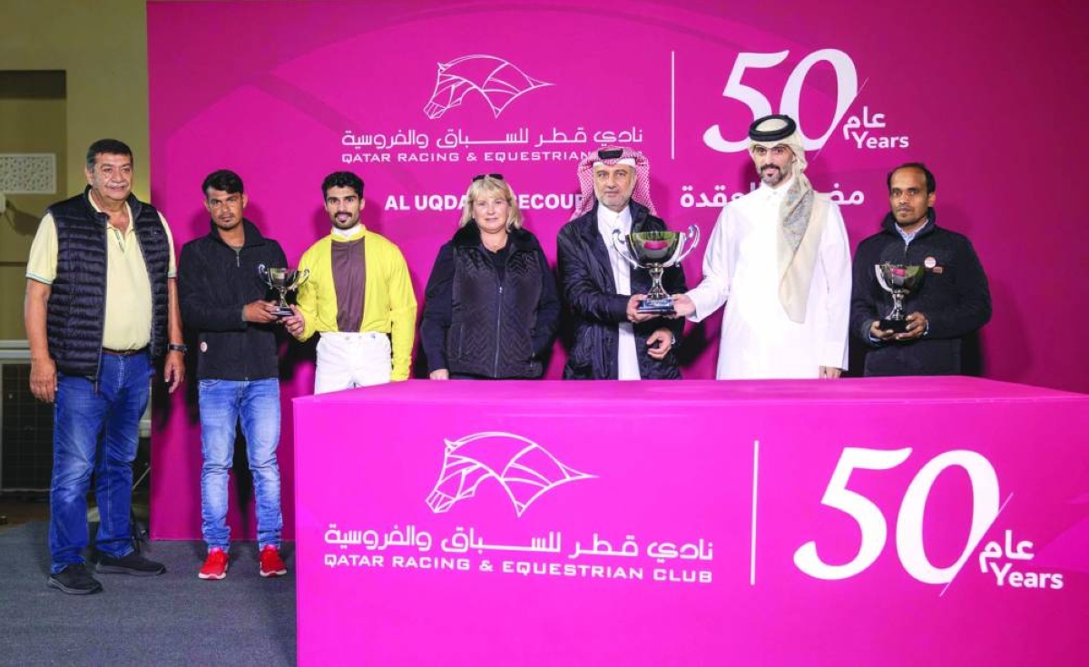 
The connections of Magna Grecia Star celebrate with the trophies at the Qatar Racing and Equestrian Club’s Al Uqda Racecourse yesterday. 