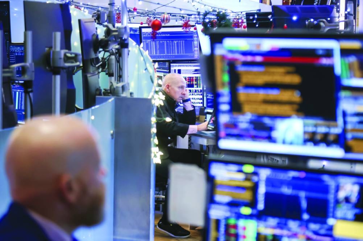 Traders work on the floor at the New York Stock Exchange. As the S&P 500 pushed to fresh records last week, investors were again forced to confront a painful reality: Keeping pace with the market has largely meant owning little else.