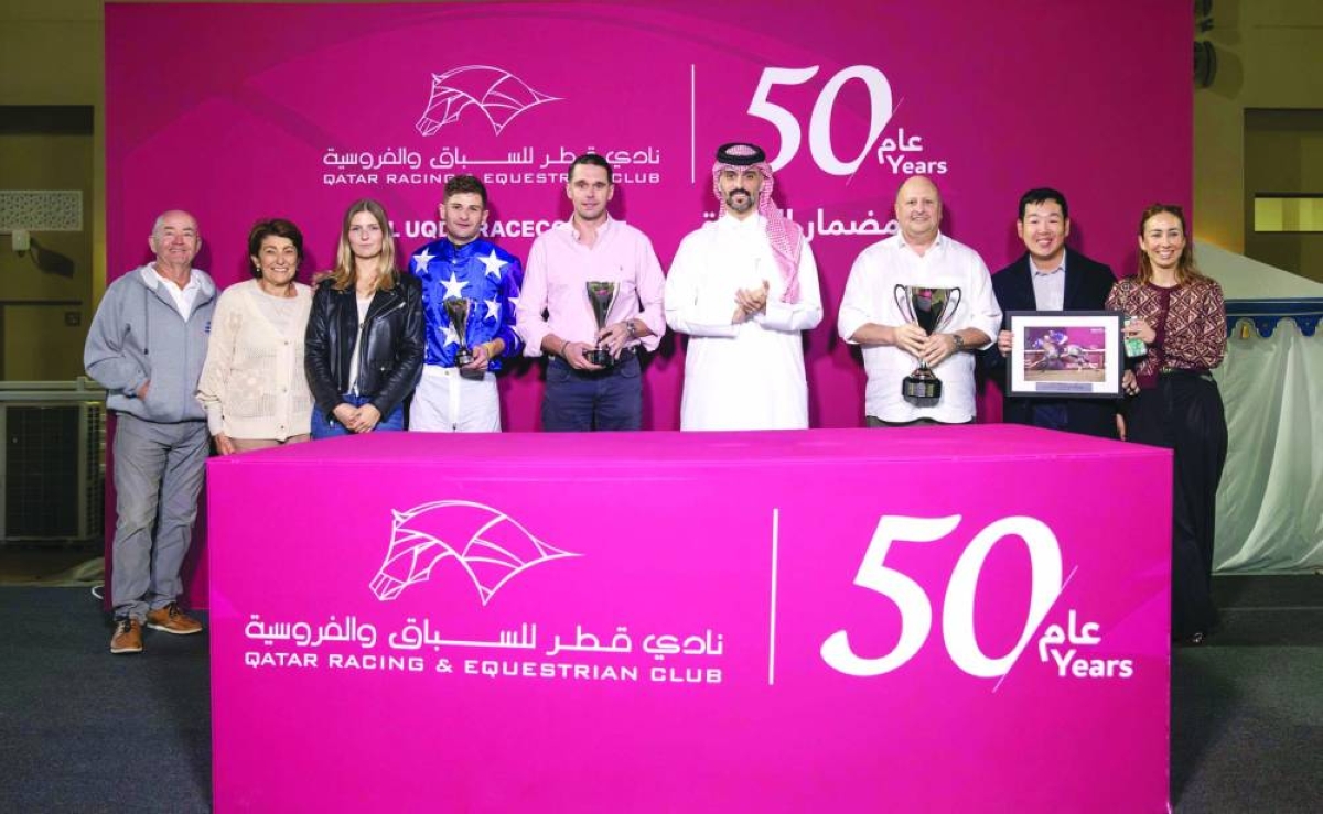 Connections of Mubkhar Al Shahania celebrate after the grey colt won the Ras Mlaiji Cup at the Al Uqda Racecourse Saturday. 