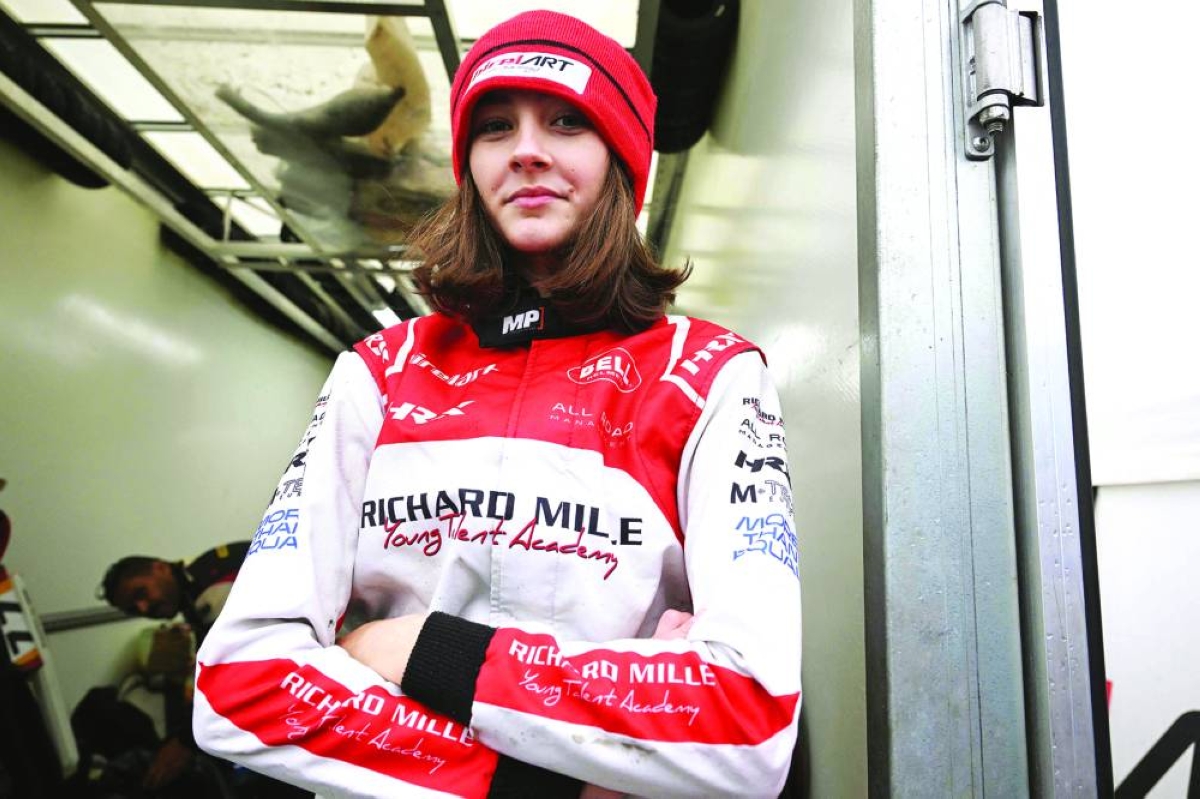 This photo taken on November 15, 2025 shows 15-year-old Skye Parker posing during a day out at the Shenington Kart Racing Club track in Shenington, central England. A dozen girls whizzed around an English karting track, part of a pioneering drive to draw women into motorsports and maybe even race to the top in male-dominated Formula 1. (Photo by Paul ELLIS / AFP)