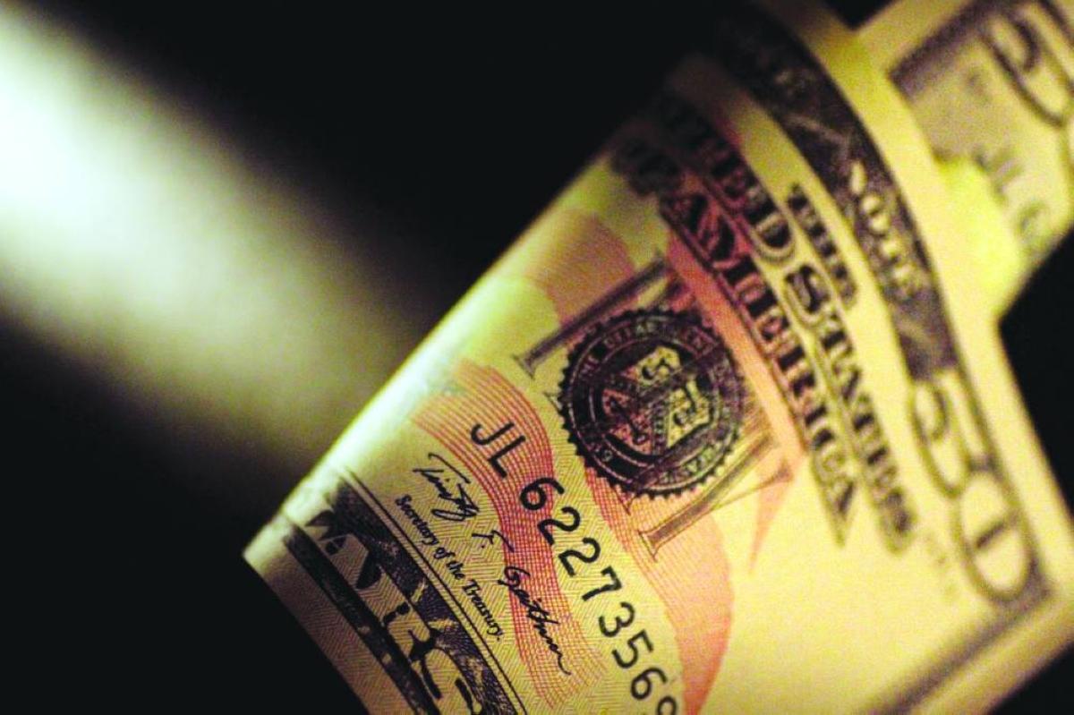 The US dollar will slide against peers again in 2026 though the moves will be more muted than in 2025, according to Emirates NBD