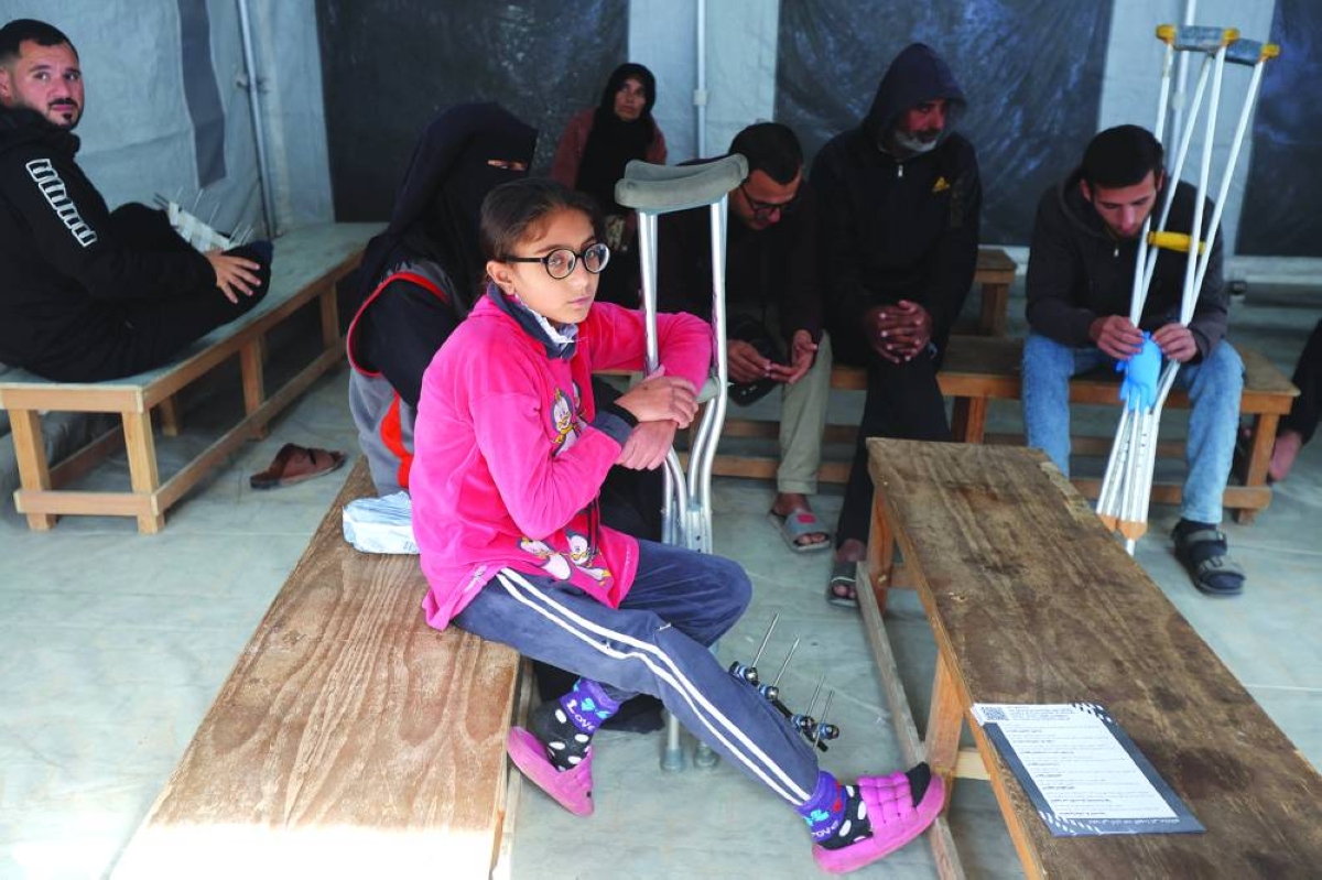 Palestinian war-wounded patients wait to receive medical treatment at a clinic run by medical charity Medecins Sans Frontieres (MSF), amid shortages of medical supplies, in Khan Younis, southern Gaza Strip, Wednesday.