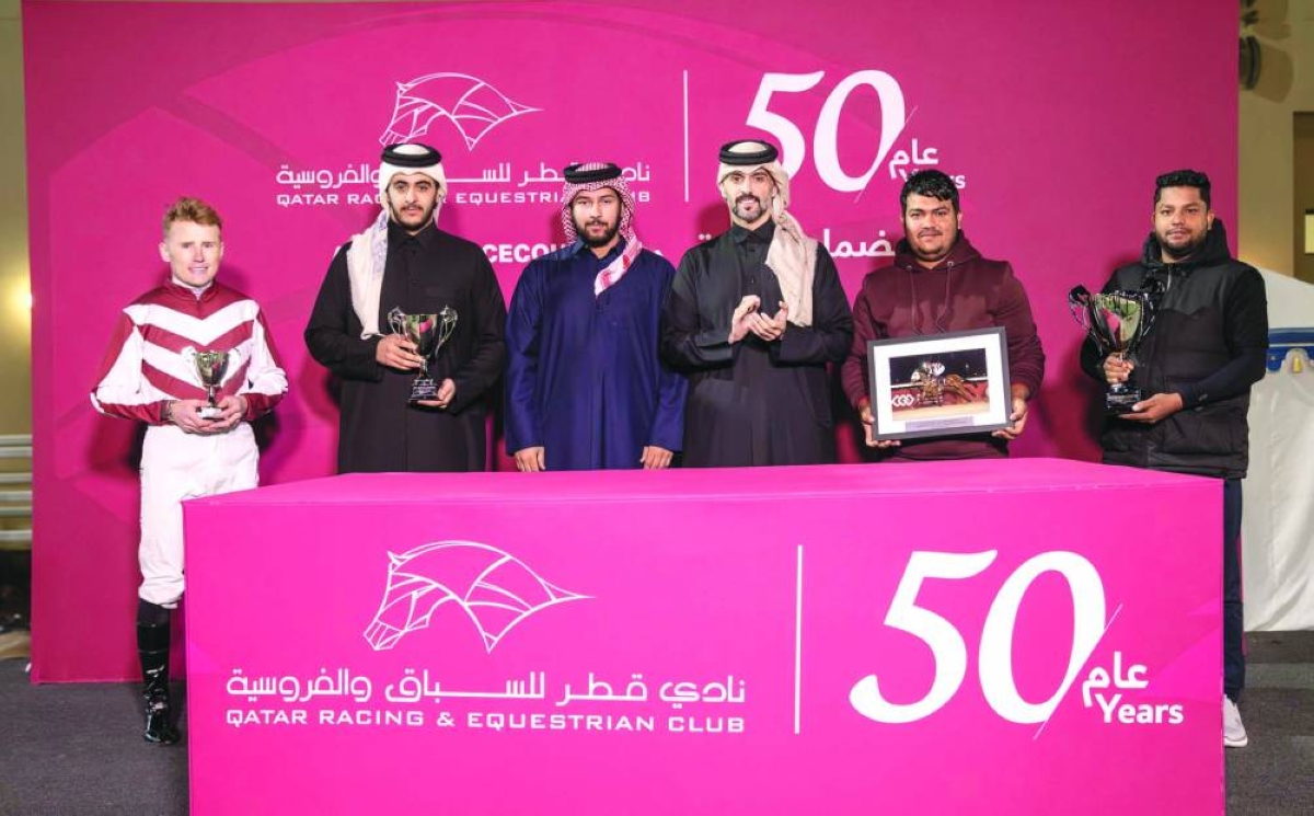 Connections of Jalila Alghania celebrate after the four-year-old bay filly claimed the End Of Year Cup at the Al Uqda Racecourse Wednesday. 