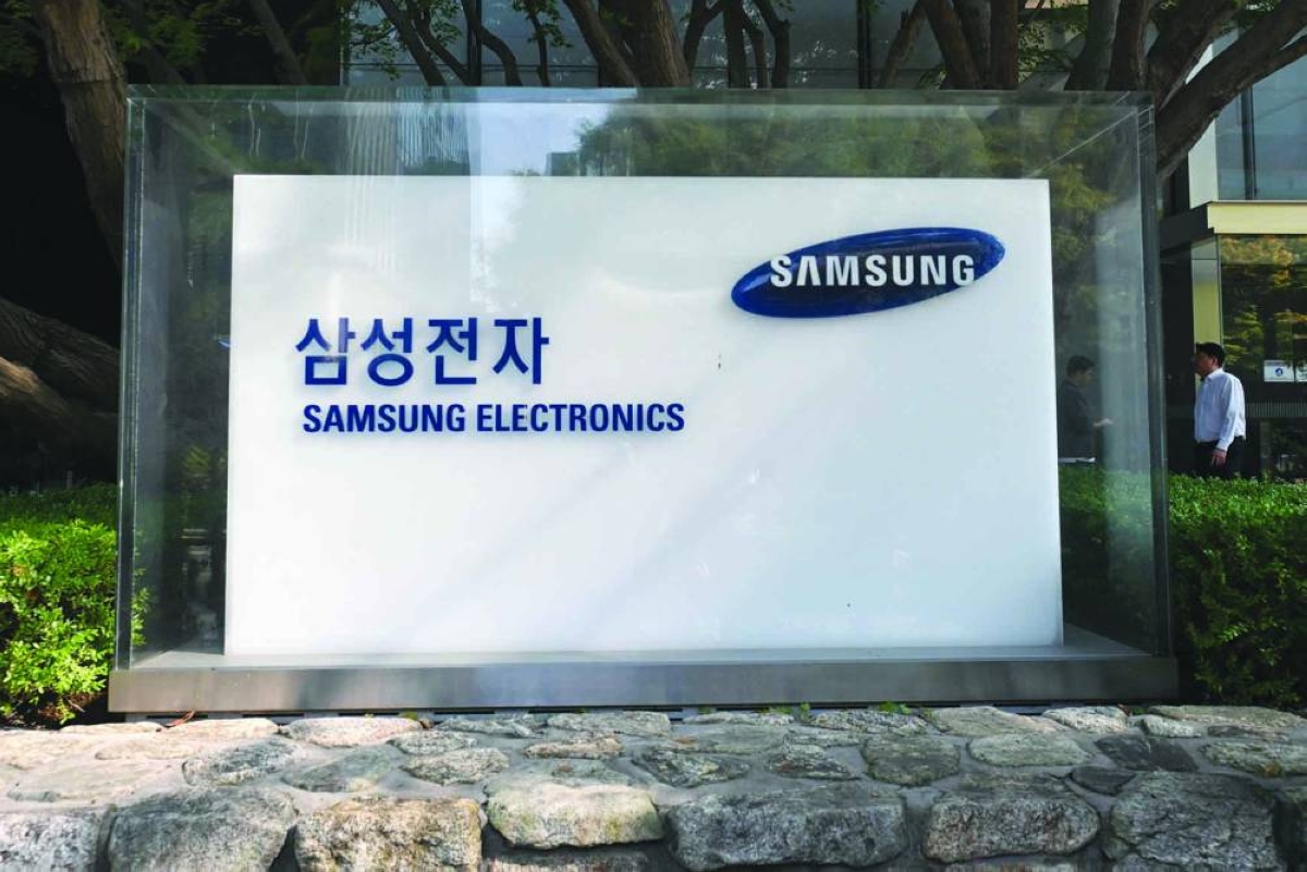 A man walks past a signboard of Samsung Electronics outside the company's building in Seoul. South Korean tech juggernaut Samsung Electronics is one of the world's top memory-chip makers, providing crucial components for the AI industry and the infrastructure it relies on.