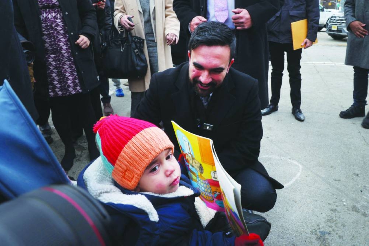 Mamdani greets a child before speaking at Grand Army Plaza in Brooklyn, New York City, on Friday. – AFP