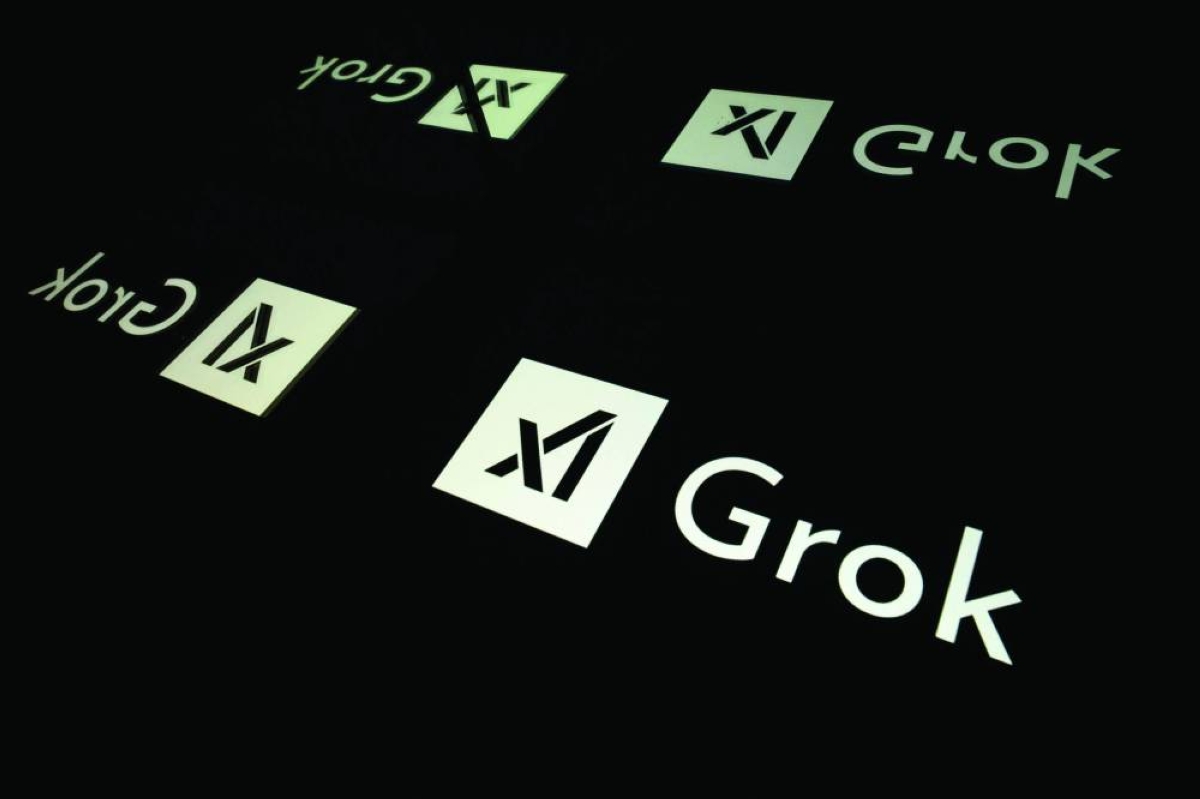 (FILES) This photograph shows screens displaying the logo of Grok, a generative artificial intelligence chatbot developed by US artificial intelligence company xAI, in Toulouse, southern France, on January 15, 2025. The Paris prosecutor's office said on January 2, 2026, it has expanded its investigation into the operation of Elon Musk's platform X to include "negationist remarks" published by its artificial intelligence tool Grok. (AFP)