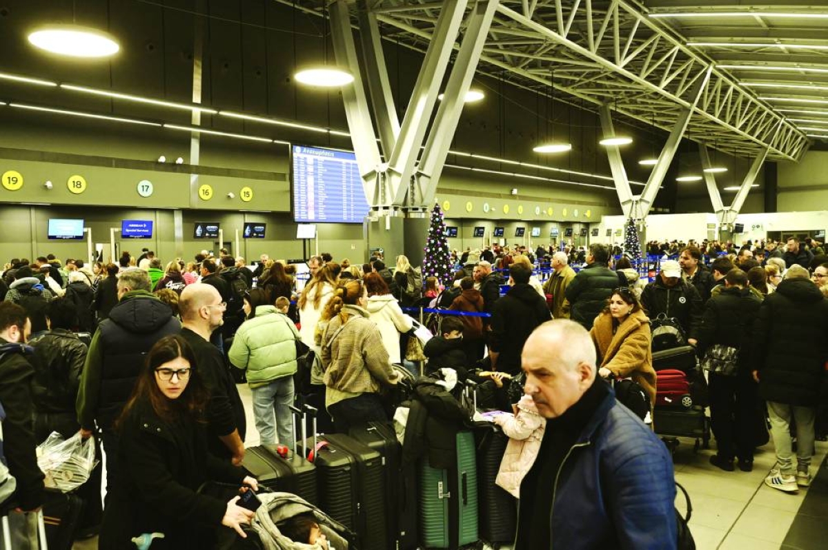 Passengers wait at the Thessaloniki Airport amidst disruption in flights across Greece linked to a technical problem at the Athens Flight Information Region (FIR). AFP