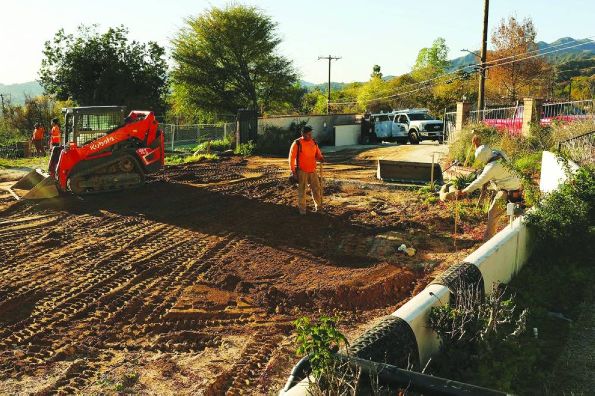 Construction workers begin building the foundation of a home destroyed by the Eaton Fire along East Loma Alta Drive and North Marengo Ave in Altadena, California. – AFP