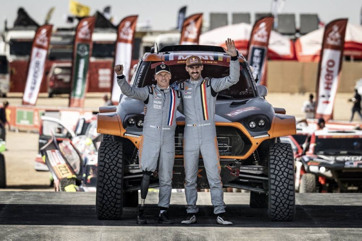 Belgium's Guillaume de ⁠Mevius and his French co-driver Mathieu Baumel celebrate after winning the Stage 1 of Dakar Rally in Yanbu, Saudi Arabia.