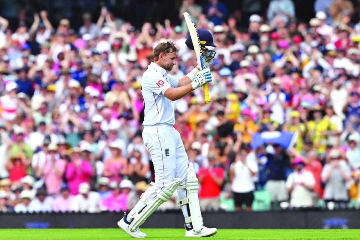 England’s Joe Root celebrates reaching his century on day two of the fifth Ashes Test at the Sydney Cricket Ground Monday. (AFP)