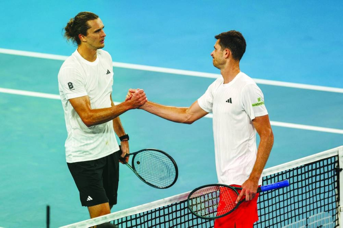 Poland’s Hubert Hurkacz (right) is congratulated by Germany’s Alexander Zverev after his victory in their singles match at the United Cup on Ken Rosewood Arena in Sydney Monday. (AFP)