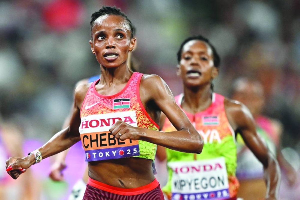 
Kenya’s Beatrice Chebet (left) and Kenya’s Faith Kipyegon cross the finish line in the women’s 5,000m final during the World Athletics Championships in Tokyo on September 20, 2025. (AFP) 