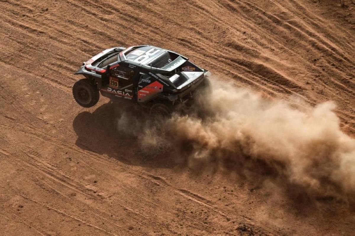 Dacia Sandriders' Qatari driver Nasser al-Attiyah and Belgian co-driver Fabian Lurquin compete during the stage three of the 48th edition of the Dakar Rally in Al Ula, Saudi Arabia.
