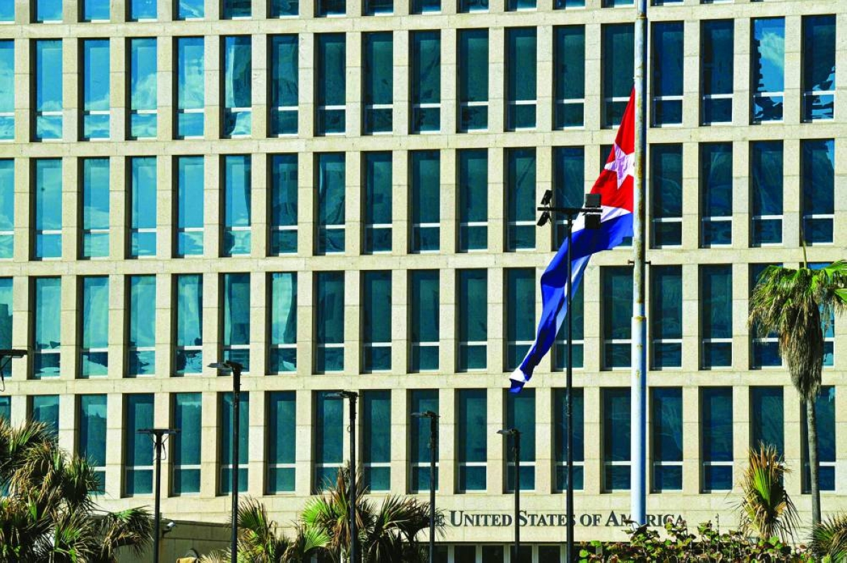The Cuban national flag flies at half-mast outside the US Embassy in Havana. Havana declared two days of national mourning as of January 5 after a total of 32 Cubans were killed during the US attack on Caracas that culminated in the capture of Venezuela's president Nicolas Maduro. (AFP)